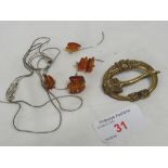 TWELVE AMBER PIECES ON A 925 WHITE METAL THREAD, AND A BROOCH STAMPED MADE IN FINLAND