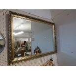 RECTANGULAR BEVELED EDGE WALL MIRROR IN A GILT EFFECT FRAME