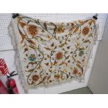 A HAND-EMBROIDERED FLORAL TABLE CLOTH / WALL HANGING DEPICTING AUTUMNAL LEAVES AND FLOWER WITH