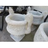 PAIR OF COMPOSITE STONE TWO HANDLED URNS