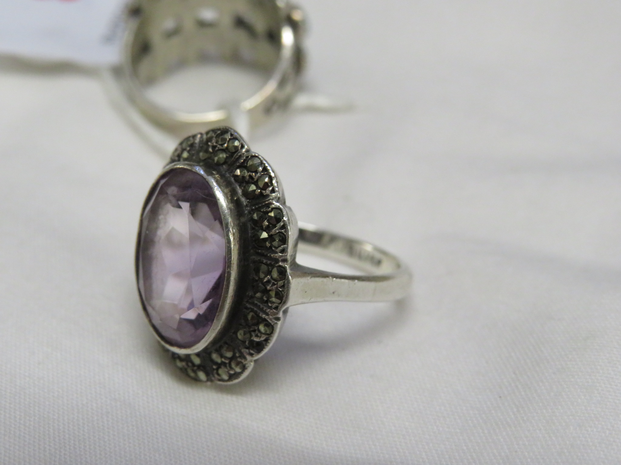 WHITE METAL RING SET WITH TURQUOISE AND STAMPED STERLING, AND A WHITE METAL AMETHYST AND MARCASITE - Image 3 of 3