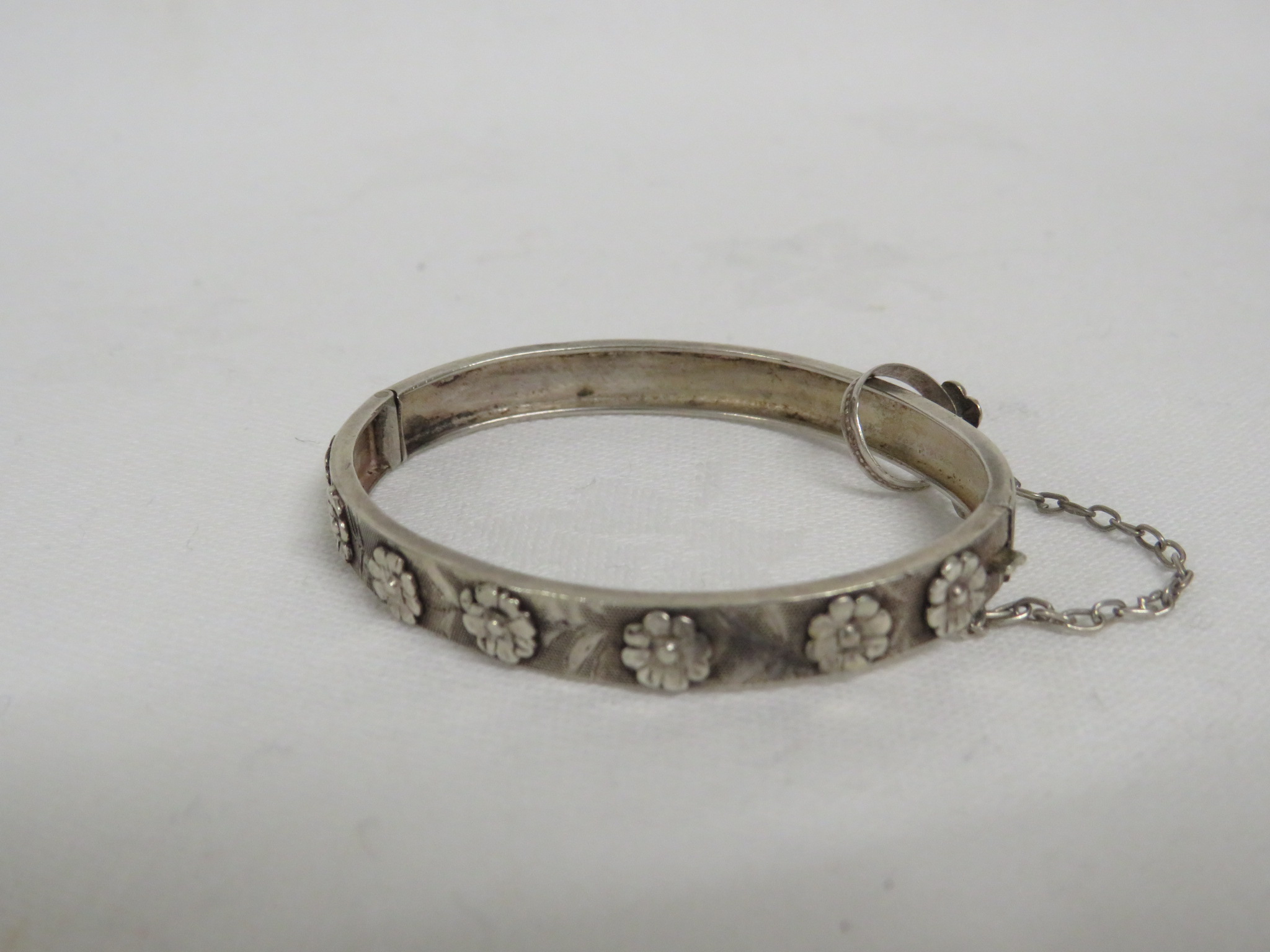 FRENCH SILVER BABY'S BRACELET AND MATCHING RING, DESIGNED WITH FORGET-ME-NOTS, CIRCA 1890-1910