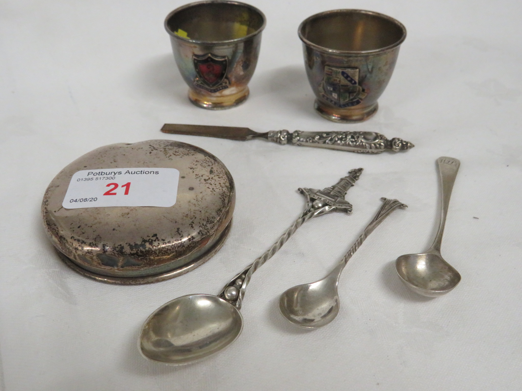 SILVER LID, TWO SILVER-PLATED BEAKERS LABELLED BEAULIEU, TWO SILVER CONDIMENT SPOONS, SILVER TOURIST