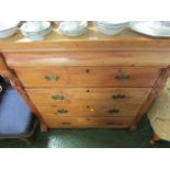PINE CHEST OF FOUR DRAWERS WITH BRASS HANDLES AND TOP CUSHIONED DRAWER