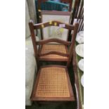 PAIR OF OAK FRAMED SIDE CHAIRS WITH CANED SEATS