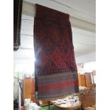 HAND KNOTTED WOOLEN RED GROUND MESHWANI FLOOR RUNNER WITH GEOMETRIC PATTERN (258 X 57 CM)