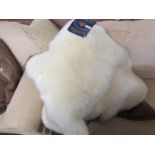 TWO SHEEPSKIN JACKETS AND TWO LAMBSKIN RUGS