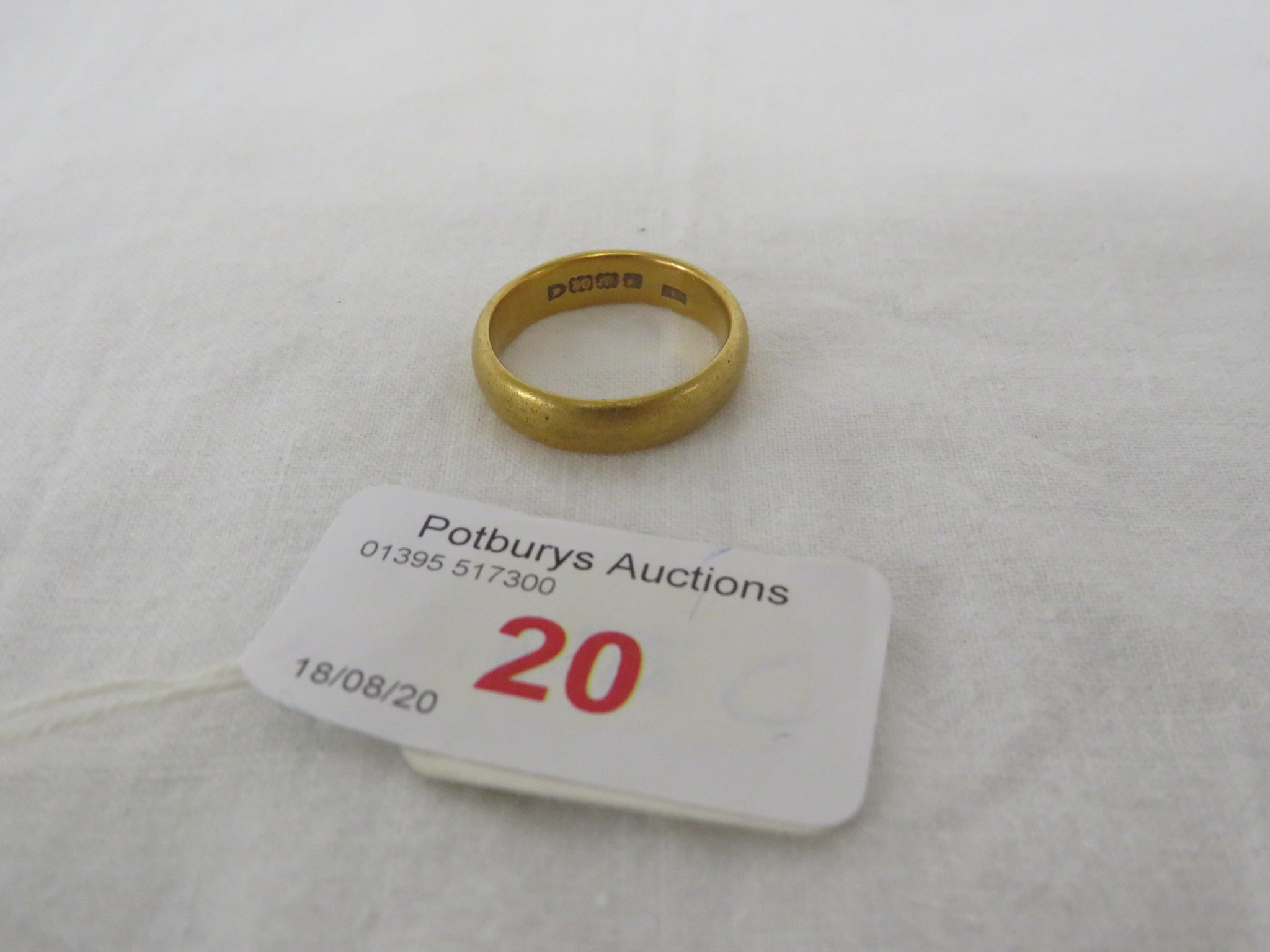 22 CARAT GOLD WEDDING RING, BRITISH HALLMARKS, FAINTLY ENGRAVED WITH A NAME TO THE INSIDE, 8.4G,