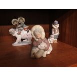 THREE LLADRO FIGURAL GROUPS OF INUIT CHILDREN