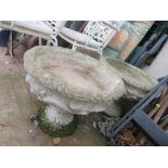 PAIR OF COMPOSITE STONE CIRCULAR PLANTERS ON PLINTHS