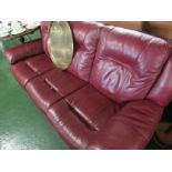 BURGUNDY LEATHER THREE PIECE SUITE, COMPRISING A MANUALLY RECLINING THREE-SEATER AND TWO-SEATER SOFA