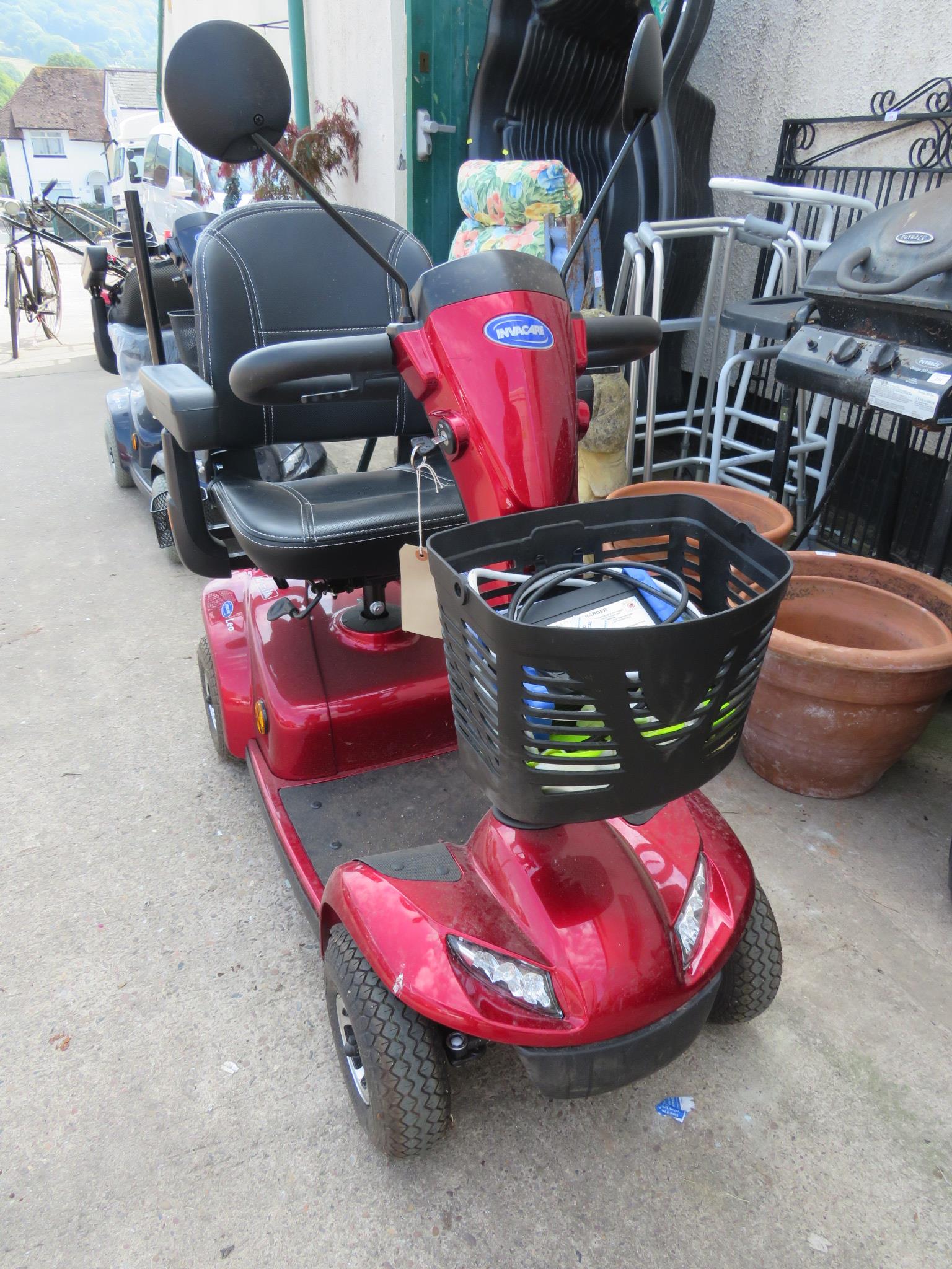 INVACARE LEO RED FOUR WHEEL MOBILITY SCOOTER, WITH KEY, BATTERY CHARGER AND USER MANUAL - Image 2 of 8