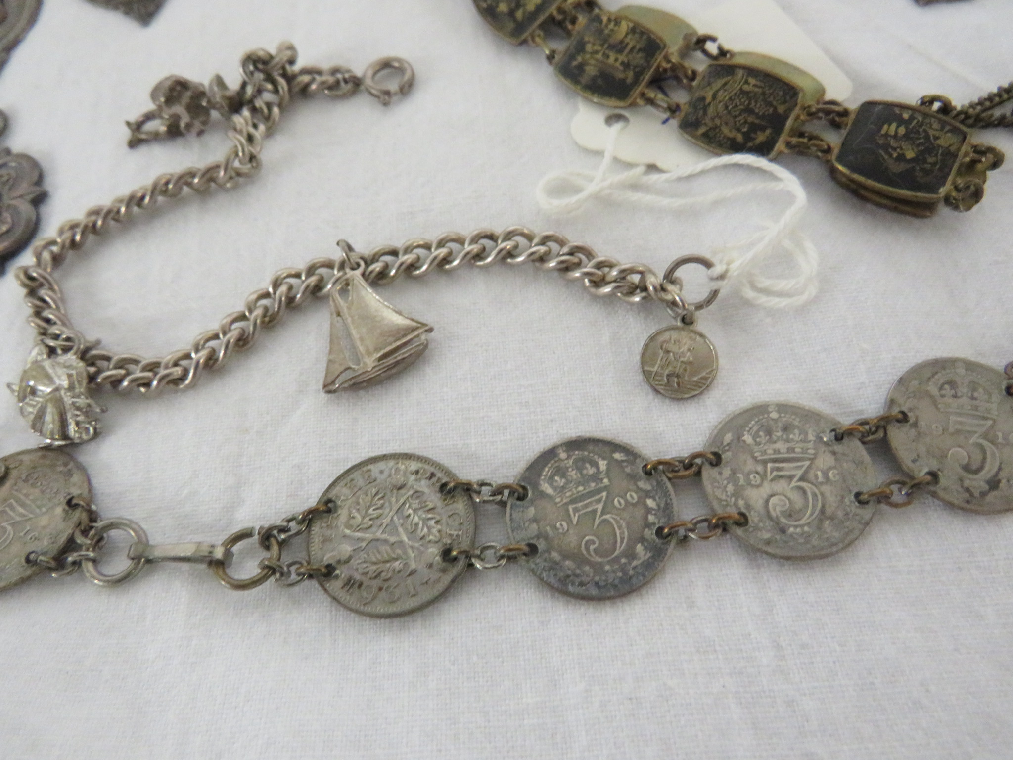 A SILVER FOOTBALL MEDALLION AND TEN OTHER SILVER MEDALLIONS, A CHARM BRACELET, SILVER THREEPENCE - Image 2 of 4