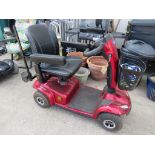INVACARE LEO RED FOUR WHEEL MOBILITY SCOOTER, WITH KEY, BATTERY CHARGER AND USER MANUAL