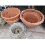 FOUR LARGE TERRACOTTA GARDEN POTS AND ONE COMPOSITE STONE POT