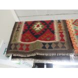 HAND KNOTTED WOOLEN BROWN GROUND PATTERNED FLOOR RUG (133 X 82 CM)
