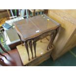 NEST OF THREE WOODEN OCCASIONAL TABLES WITH GLASS TOPS