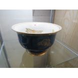 CARLTON WARE LUSTRE BOWL ON FOOT DECORATED WITH MOTHS AND BUTTERFLIES, THE EXTERIOR MOTTLED BLUE