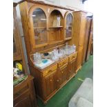 HONEY PINE ILLUMINATED DRESSER, TWO GLAZED DOORS TO TOP AND THREE CUPBOARD DOORS TO BASE (NEEDS A