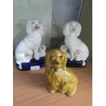 PAIR OF STAFFORDSHIRE POTTERY SPANIELS WITH PUPPIES TOGETHER WITH ONE OTHER POTTERY SPANIEL