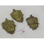 THREE ASHANTI BRASS FACE MASK PENDANTS, INDIVIDUALLY MADE