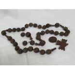 THIRTY-SEVEN HAND CARVED LOURDES BEADS AND PENDANT DATED 1875