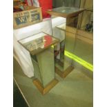 TWO MIRRORED GLASS STANDS