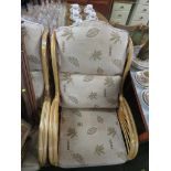 THREE RATTAN FRAME CONSERVATORY ARMCHAIRS WITH FOLIATE BEIGE CUSHIONS