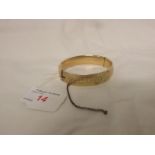 GOLD-PLATED HALF-ENGRAVED BANGLE STAMPED 9CT METAL CORE