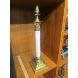 ELECTRIC TABLE LAMP AS A CLASSICAL COLUMN WITH WHITE GLASS BODY AND BRASS MOUNTS (NEEDS REWIRING)