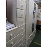 BEIGE MELAMINE THREE DOOR WARDROBE WITH CENTRAL MIRRORED DOOR, CHEST OF FIVE DRAWERS AND A THREE
