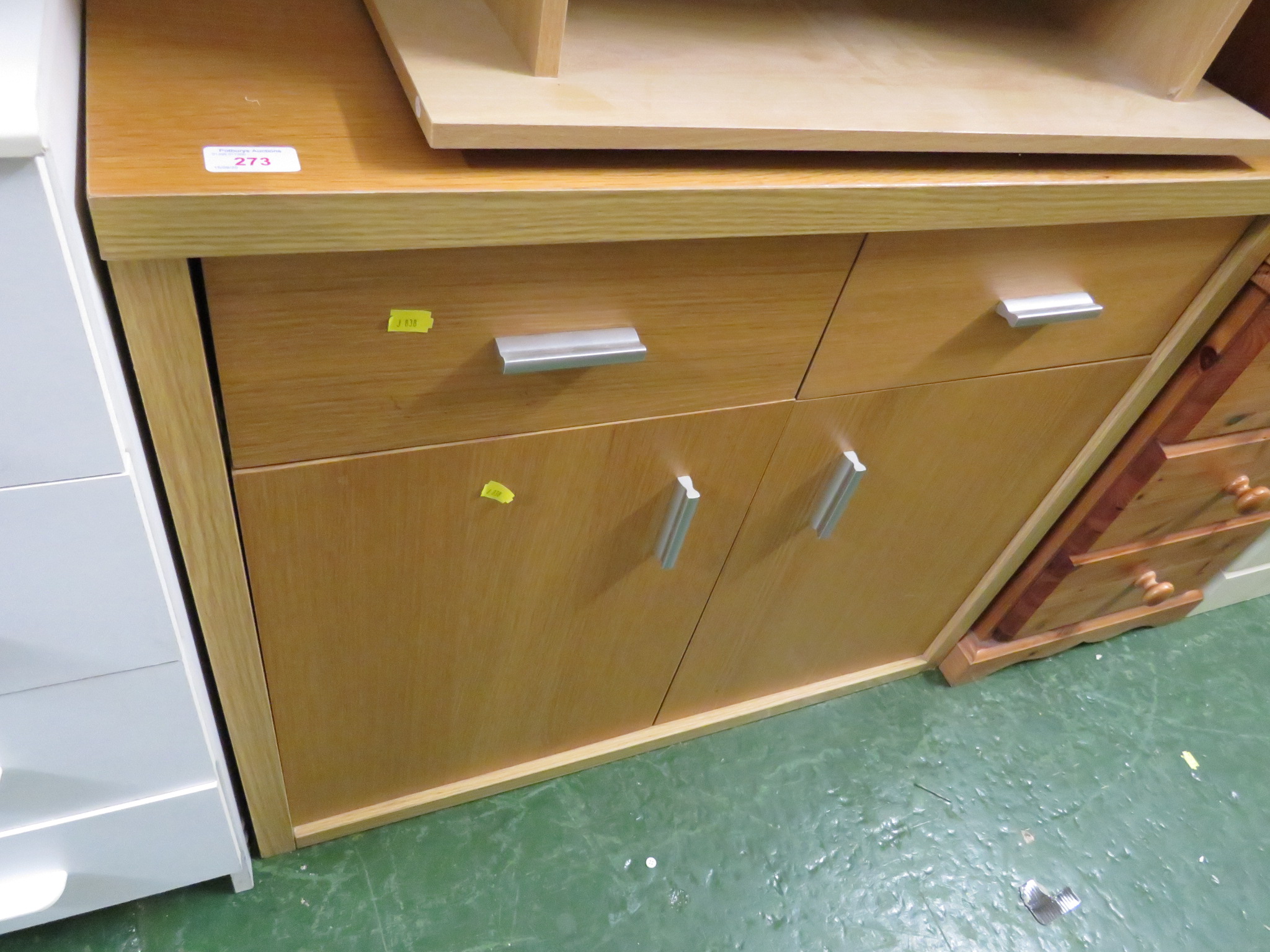 SIMULATED TEAK VENEERED ENCLOSED CABINET WITH TWO DRAWERS