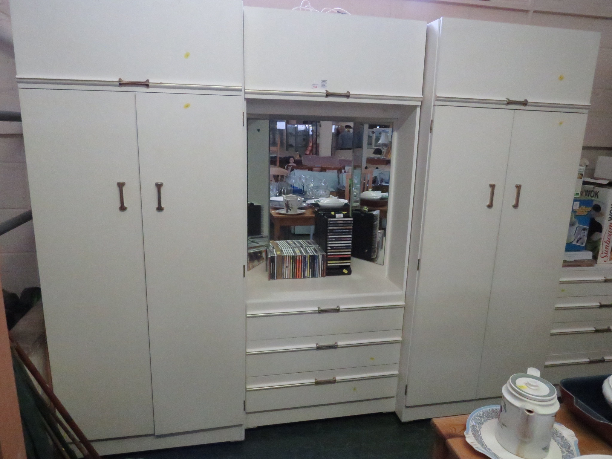 WHITE MELAMINE FOUR-PART BEDROOM SUITE COMPRISING AN ILLUMINATED VANITY UNIT (NEEDS A PLUG), TWO