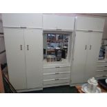 WHITE MELAMINE FOUR-PART BEDROOM SUITE COMPRISING AN ILLUMINATED VANITY UNIT (NEEDS A PLUG), TWO