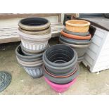 ASSORTED PLASTIC GARDEN POTS AND ONE TERRACOTTA POT