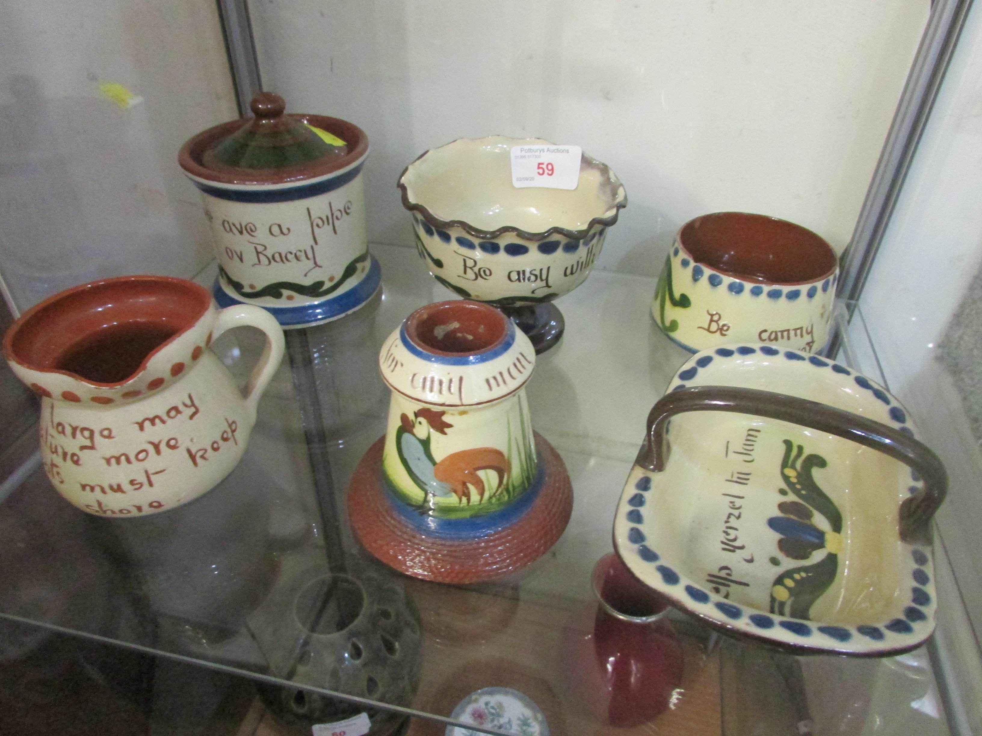 SIX PIECES OF MOTTO WARE INCLUDING MATCH STRIKER, JUG AND TOBACCO JAR