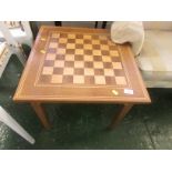 LIGHT WOOD OCCASIONAL TABLE WITH CHESSBOARD TOP AND SINGLE DRAWER