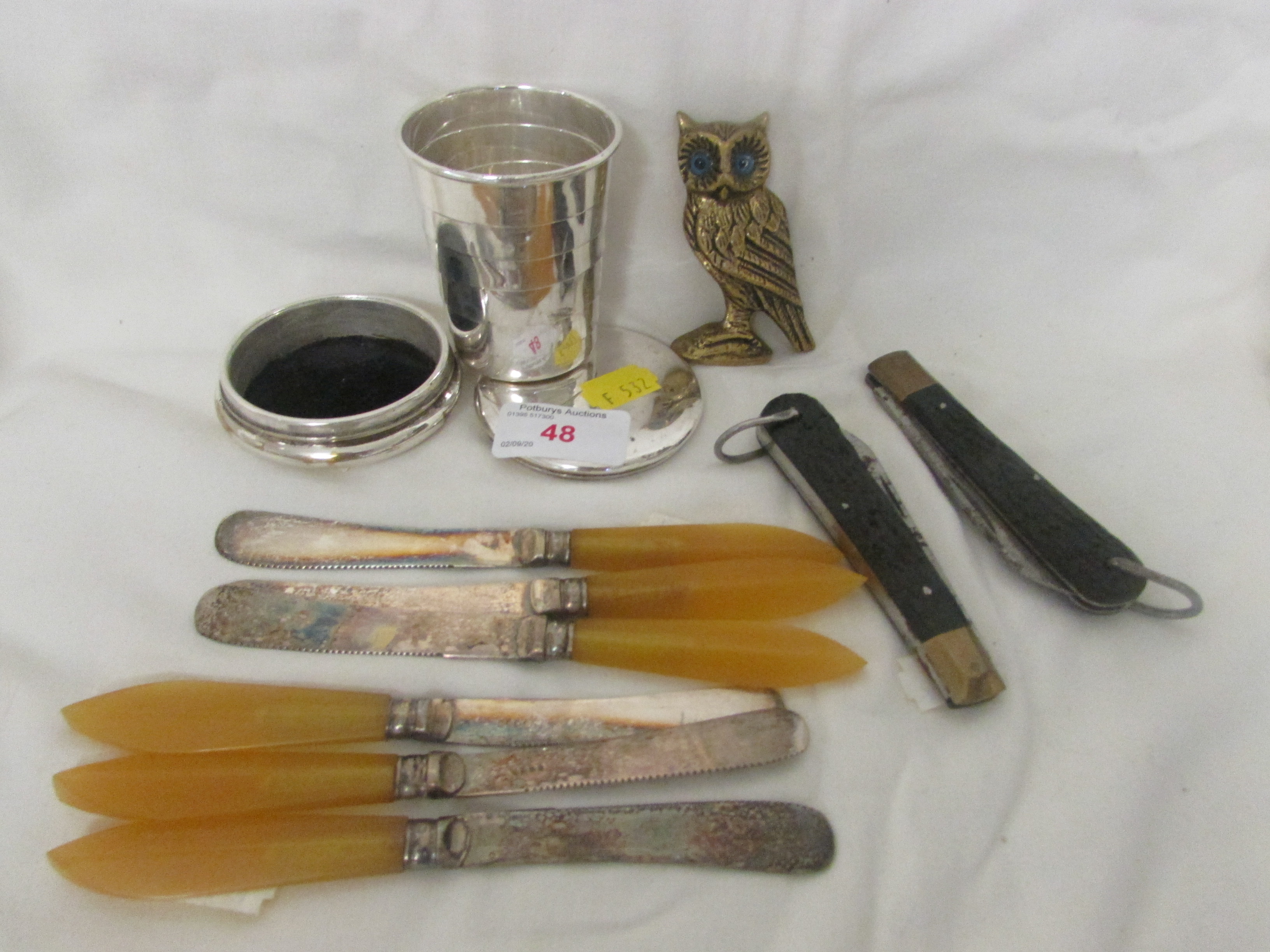 SILVER-PLATED TRAVEL CUP, SILVER-PLATED KNIVES, BRASS OWL FIGURINE AND TWO PENKNIVES