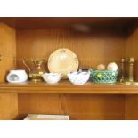 ONE SHELF OF DECORATIVE WARE INCLUDING BRASS CANDLE STICKS, STUDIO POTTERY, WOODEN FRUIT ETC