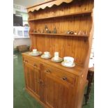 FARMHOUSE STYLE HONEY PINE DRESSER WITH TWO DRAWERS OVER TWO CUPBOARD DOORS WITH BRASS HANDLES
