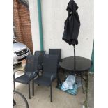 CIRCULAR METAL FOLDING GARDEN TABLE WITH GLASS TOP, FOUR METAL FRAMED CHAIRS WITH FIBRE SEATS, BLACK