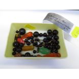 SMALL TRAY ASSORTED BEADS INCLUDING DARK RED AMBER.