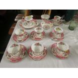 ROYAL ALBERT LADY CARLYLE TEA SERVICE COMPRISING CUPS, SAUCERS AND TWO CAKE PLATES.