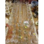 Selection of drinking glasses, sundae dishes and stoppered bottles