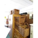 Four wicker hampers, with a wicker basket.