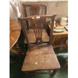 TWO OAK SIDE CHAIRS WITH PLANK SEATS. AS FOUND.