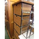 Metal framed unit with five wicker drawers.