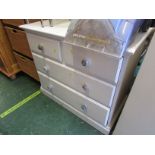 White painted pine chest of four drawers with ceramic handles.