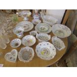 Assortment of pierced decorative porcelain baskets, bowls and plates