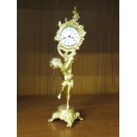 REPRODUCTION ROCOCCO STYLE TABLE ALARM CLOCK, GILT CAST METAL MODELLED AS A BOY, DIAL MARKED 8 ANCRE